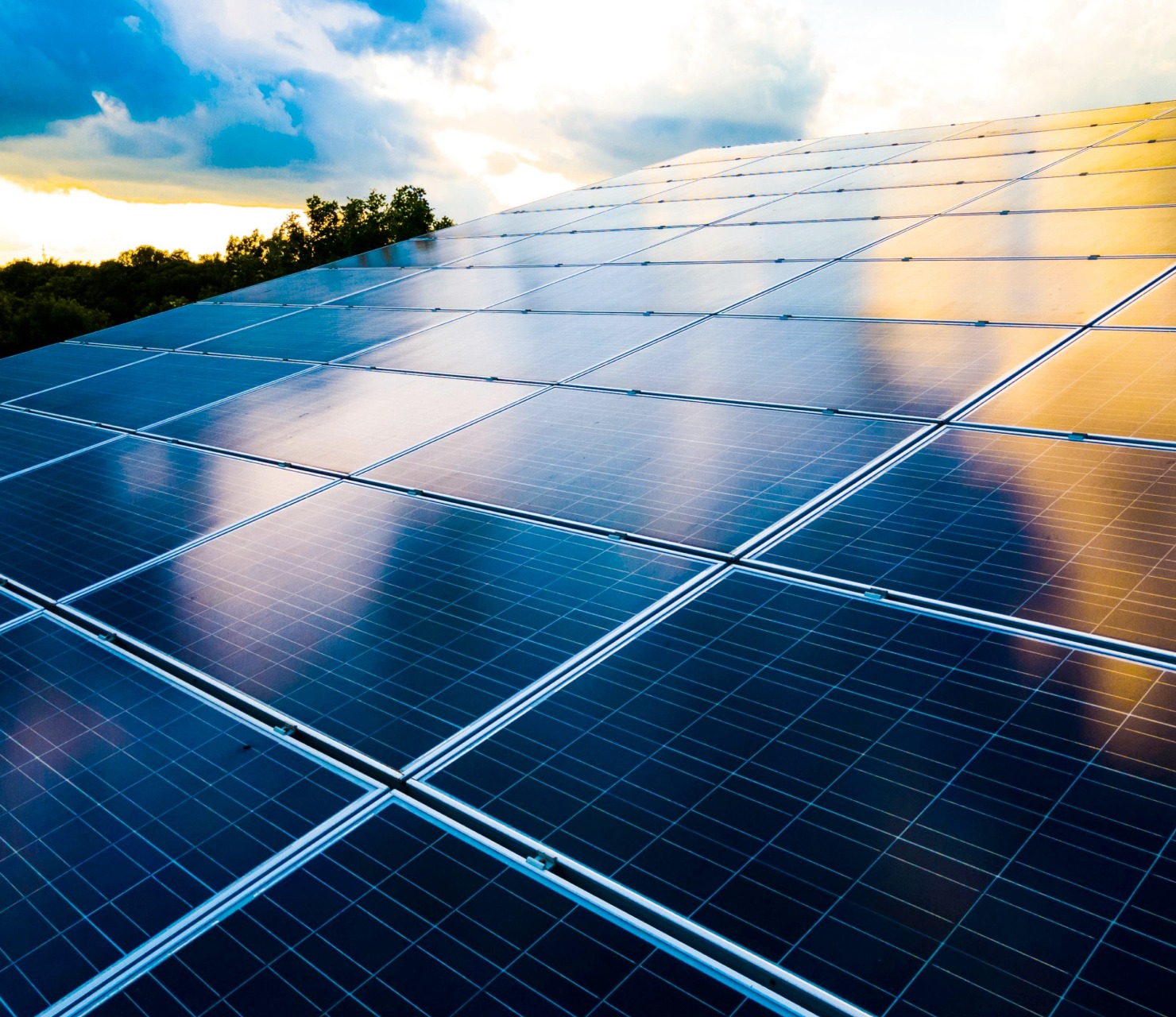 Solar panels with sunset reflection