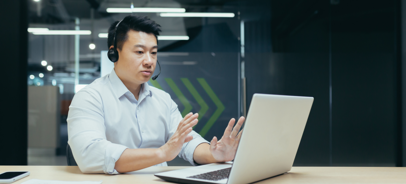 O&M analyst monitoring operations from desk
